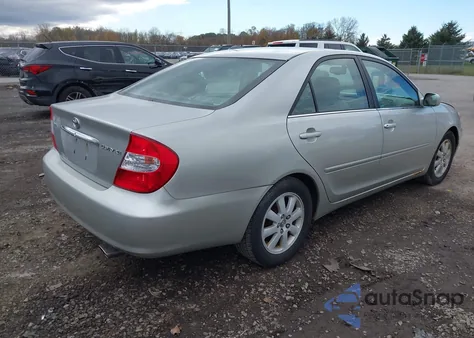 2004 Toyota Camry Xle z USA, uszkodzony, nr VIN 4T1BE30K74U295721